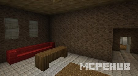 Красивая комната с большим красным диваном и деревянным столом