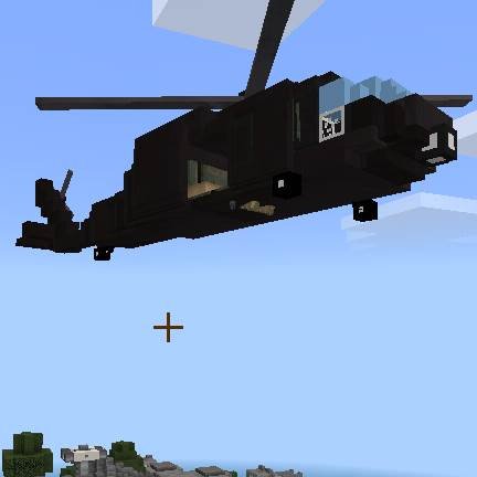 Чёрный военный вертолёт летит по воздуху