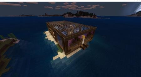 Небольшой деревянный домик на острове посреди моря