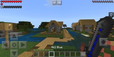 Игрок с синим мечом в деревне