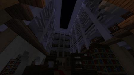 Игрок смотрит наверх внутри огромного и тёмного помещения