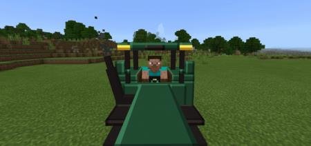 Игрок сидит за рулём трактора