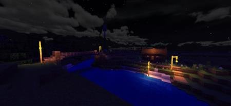 Вид на деревню, освещённую фонарями на столбах