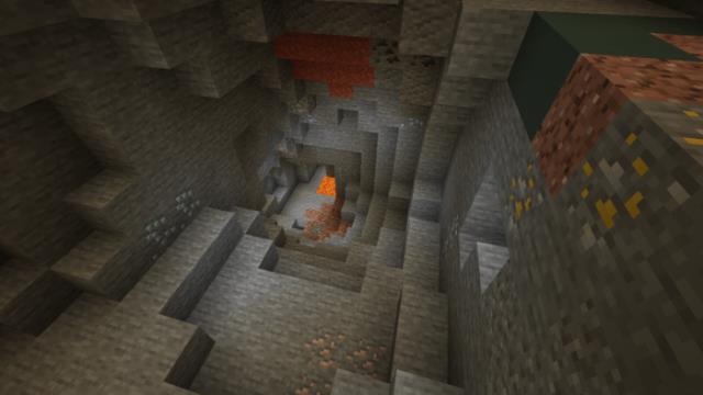Руды на стене и полу пещеры при спуске вглубь