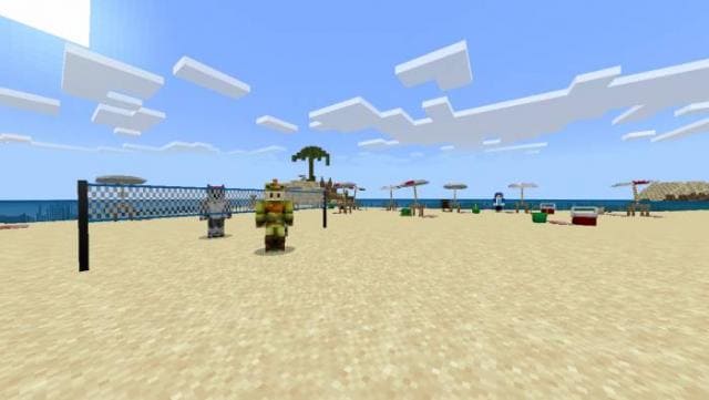 Игроки на пляже рядом с волейбольной сеткой