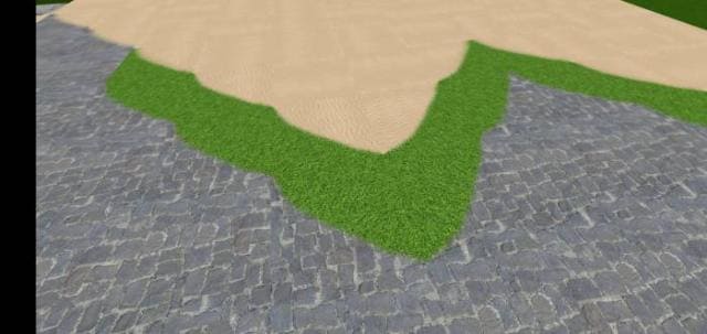 Плавное соединение камня, травы и песка