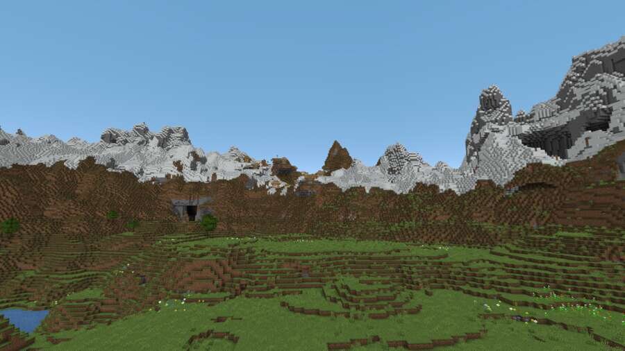 Вид на летнюю долину среди снежных гор 2