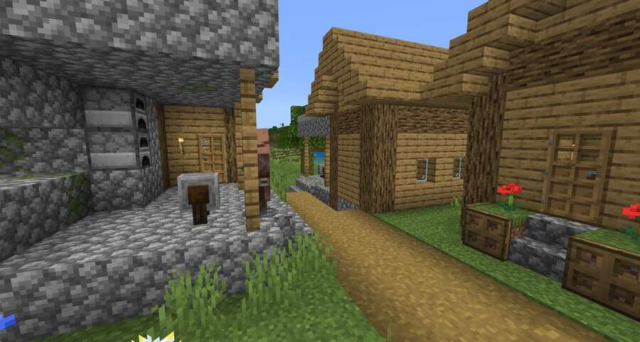 Кузница в деревне на фоне деревянных домов