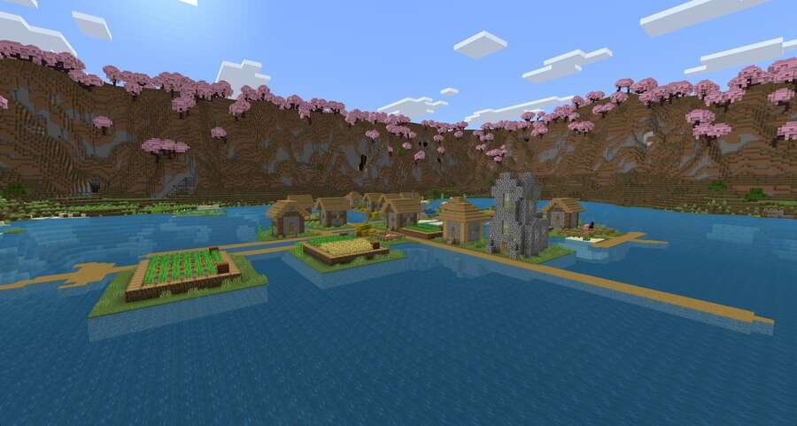 Деревушка на фоне воды и холмов с сакурой