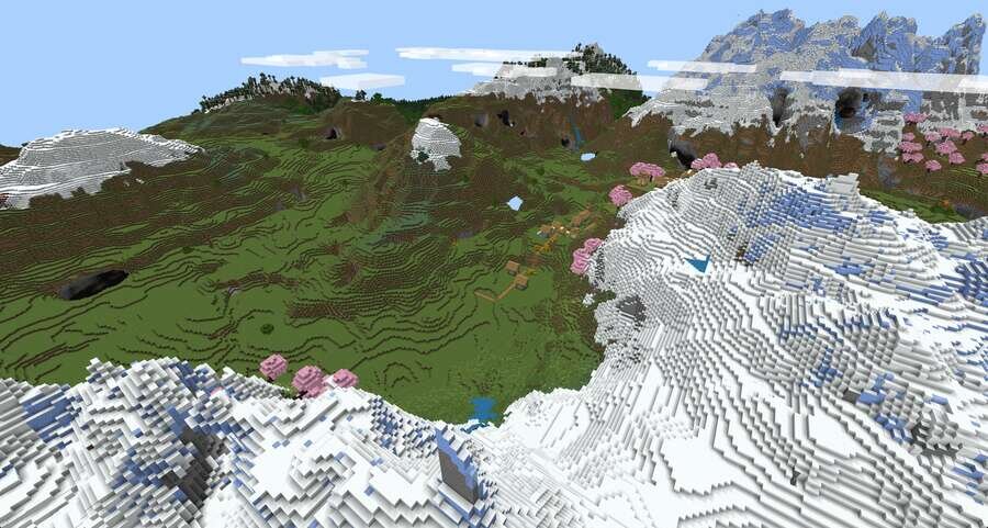 Как выглядит долины на фоне высоких, снежных гор