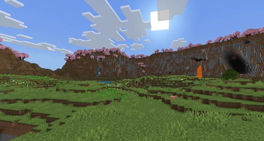 Ровная долина на фоне высоких гор