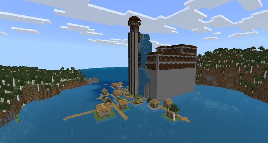 Вид на огромный особняк и деревушку посреди воды