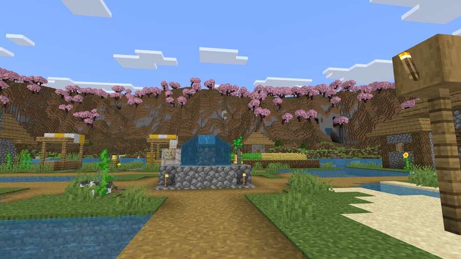 Вид из деревни на горы с сакурой