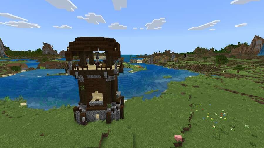 Аванпост разбойников на фоне речки, зеленых полей и деревни