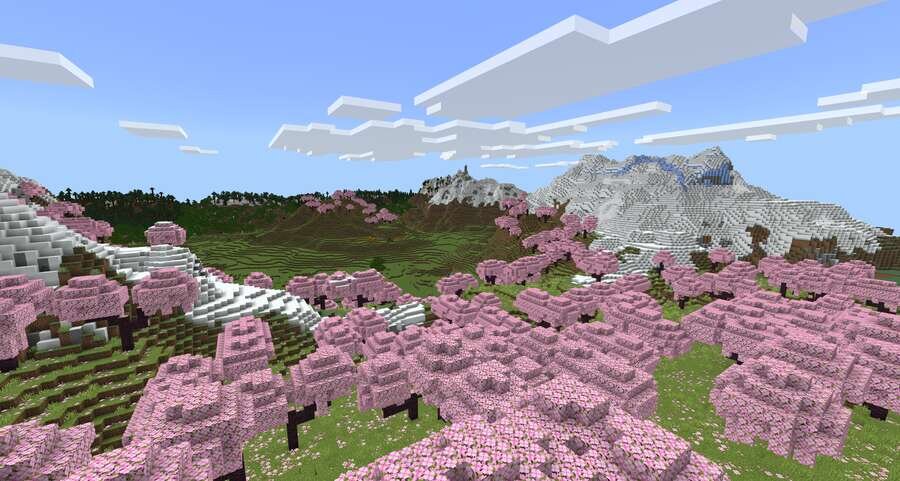 Вишневая поляна, снежные горы и зеленые поля