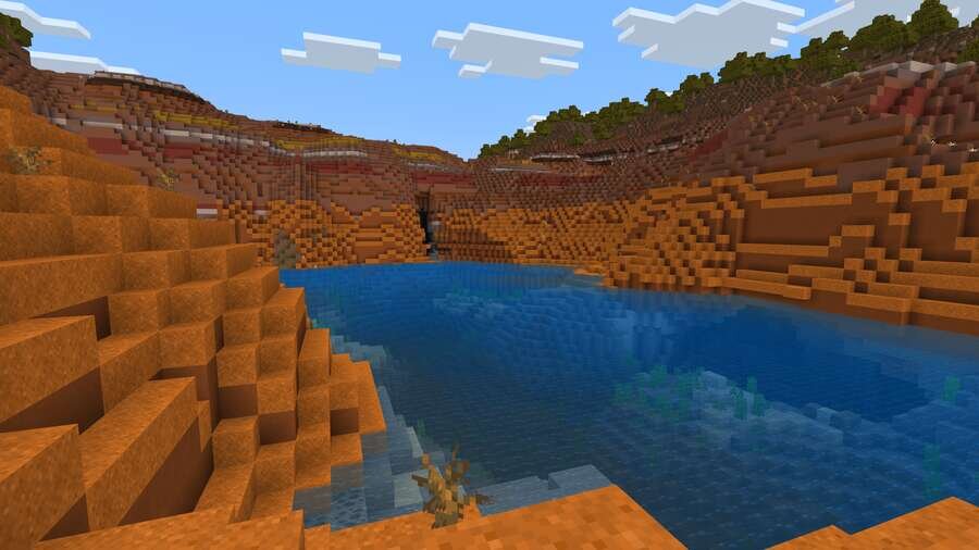 Озеро посреди оранжевых дюн в игре