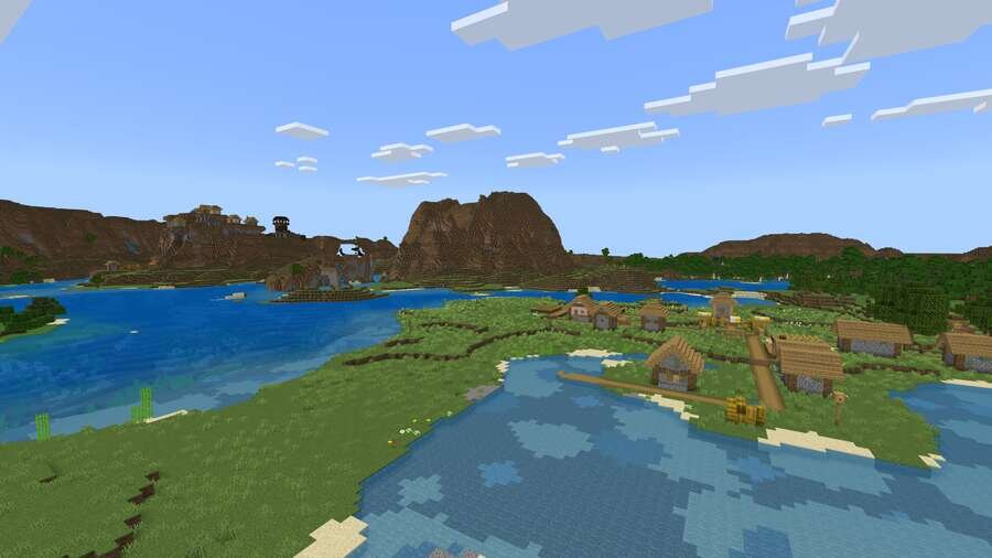 Высокие горы, красивая речка и деревня на фоне неба