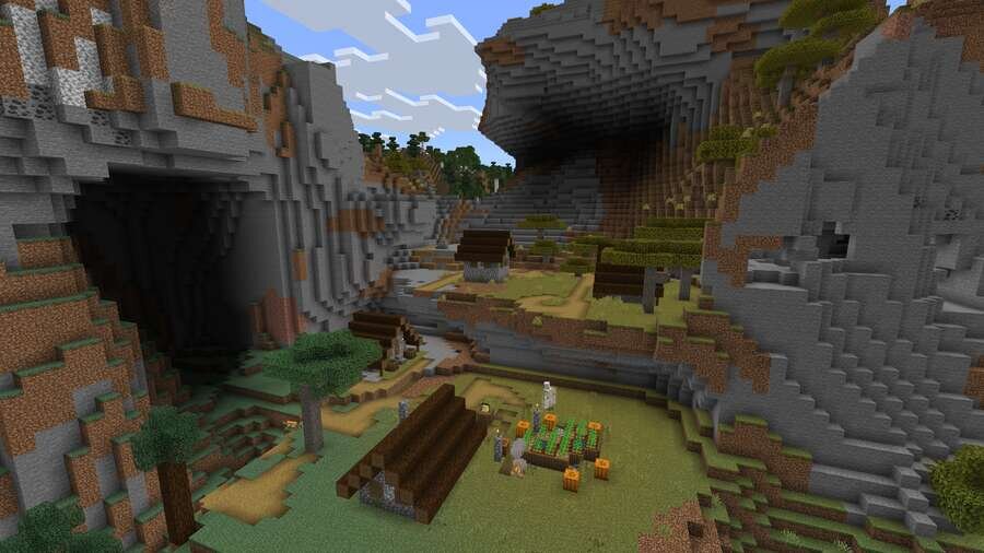 Вид на деревушку на фоне высоких, мощных горок