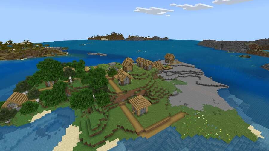 Вид на деревню на фоне океана сверху